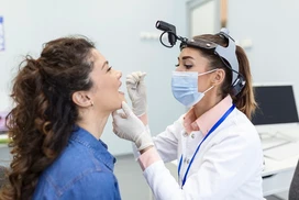 female-patient-opening-her-mouth-doctor-look-her-throat-otolaryngologist-examines-sore-throat-patient.png